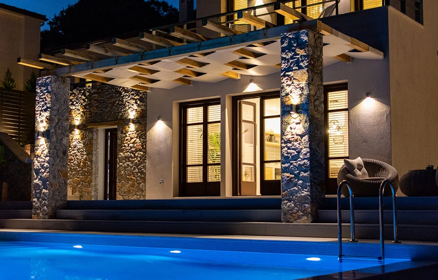 Villa terrace and swimming pool at dusk